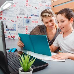 showing a mother and child working on homework