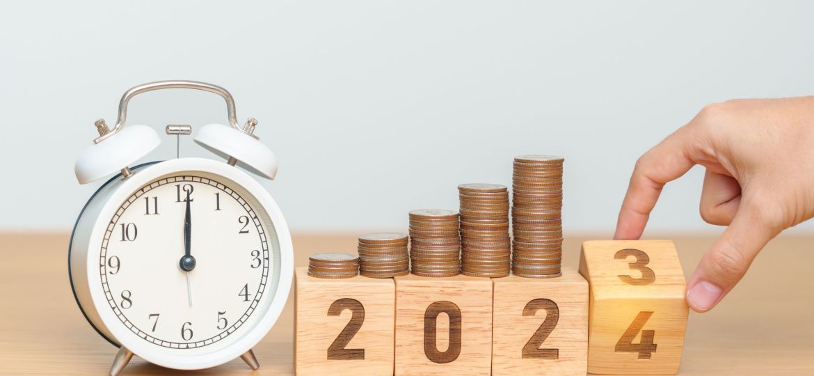 Happy New Year with vintage alarm clock and flipping 2023 change to 2024 block. Resolution, Goals, Plan, Action, Money Saving, Retirement fund, Pension, Investment and Financial concept