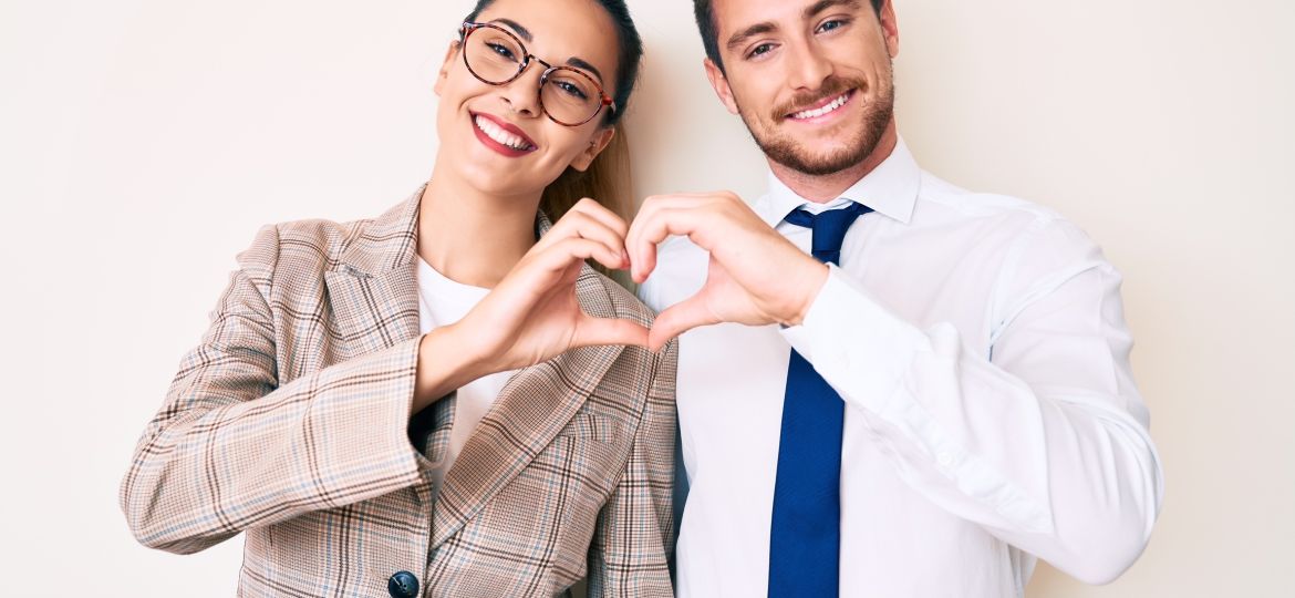 Business people making heart sign
